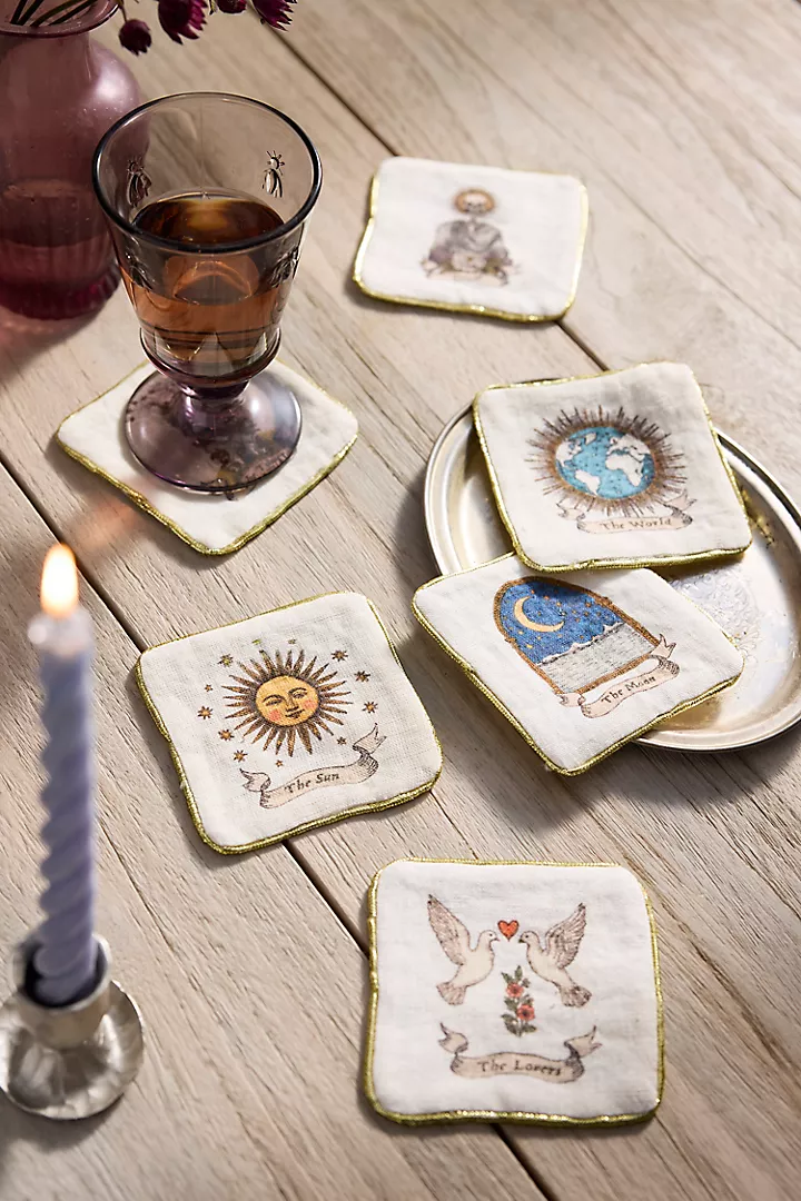 A set of linen cocktail napkins printed with mixed tarot card designs